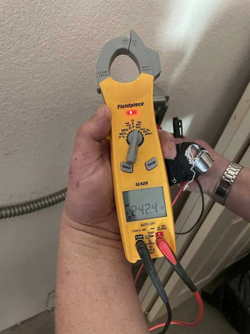 Voltage testing with clamp meter during Generator Installation in Neosho